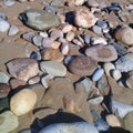 Big striped rock stone & sand background frame on beach