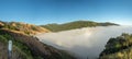 Big Sur California coast, bridge, beach, rocks, clouds, and surfing waves Royalty Free Stock Photo