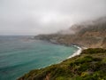 Big Sur California coast, bridge, beach, rocks, clouds, and surfing waves Royalty Free Stock Photo