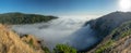 Big Sur California coast, bridge, beach, rocks, clouds, and surfing waves Royalty Free Stock Photo