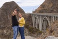 A young couple take a selfie in fron of the Big Creek Bridge, Big Sur, California, USA Royalty Free Stock Photo