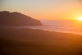 Big Sur sunset with lighthouse on rocks Royalty Free Stock Photo