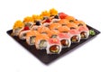 Big sushi set on black plate on white background Royalty Free Stock Photo