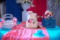 Big sweet multilevel wedding cake decorated with flowers. Concept of candy bar on party Royalty Free Stock Photo