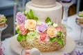 Big sweet multilevel wedding cake decorated with flowers. Concept of candy bar on party Royalty Free Stock Photo