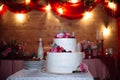 Big sweet multilevel wedding cake decorated with flowers. Concept of candy bar on party Royalty Free Stock Photo