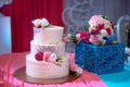 Big sweet multilevel wedding cake decorated with flowers. Concept of candy bar on party Royalty Free Stock Photo