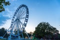 Big tall white Ferris wheel in front of a perfect blue sky Royalty Free Stock Photo