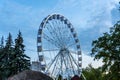 Big tall white Ferris wheel in front of a perfect blue sky Royalty Free Stock Photo