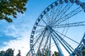 Big tall white Ferris wheel in front of a perfect blue sky Royalty Free Stock Photo