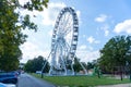 Big tall white Ferris wheel in front of a perfect blue sky Royalty Free Stock Photo