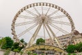 Big, tall white Ferris wheel in front of a perfect blue sky. Happy summer vacation feelings. Royalty Free Stock Photo