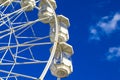 A Big, Tall White Ferris Wheel in Front of a Perfect Blue Sky on the Ocean. Happy Summer Holidays Royalty Free Stock Photo