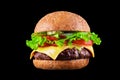 Big tasty hamburger or cheeseburger isolated on black background with grilled meat, cheese, tomato, bacon, onion. Burger Royalty Free Stock Photo