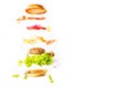 Big tasty home made burger with flying ingredients Royalty Free Stock Photo