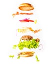 Big tasty home made burger with flying ingredients Royalty Free Stock Photo