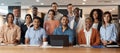 A big team with big dreams. a group of young businesspeople using a laptop at a conference in a modern office. Royalty Free Stock Photo