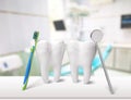 Big teeth, toothbrush and dentist mirror in Royalty Free Stock Photo