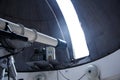 Big telescope under dome of astronomic observatory