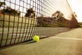 Big tennis ball at the net, nobody, outdoor court Royalty Free Stock Photo