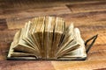 Big thick open book on brown background Royalty Free Stock Photo