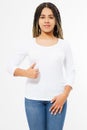 Big thumb up. Summer t shirt design and people concept close up of young afro american woman in blank template white t-shirt. Mock Royalty Free Stock Photo