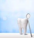 Big tooth and dentist mirror Royalty Free Stock Photo