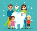 Big tooth with family. Happy smiling people, parents with children hold oral cavity care hygiene products toothpaste and