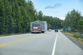 A Big Truck Carrying an Entire House Driving Through Algonquin Provincial Park on Highway 60