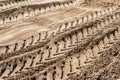 Big truck tyres traces on open sand pit surface. Quarry heavy machinery concept Royalty Free Stock Photo