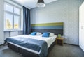 Big twin bed in blue hotel apartment Royalty Free Stock Photo