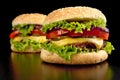 Big two cheeseburgers isolated on black background Royalty Free Stock Photo