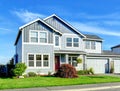 Big two story house. View of entance porch and garage