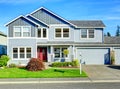 Big two story house. View of entance porch and garage