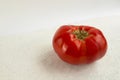 Big ugly tomato on a white background