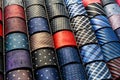 Big variety of different color neckties in a men clothing store