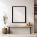 Big vertical empty mock up poster black frame on white stucco wall above wooden bench with books and vases. Scandinavian design