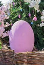 Big violet easter egg outdors. Festive street decoration for holidays