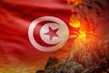 big volcano blast eruption at night with explosion on Tunisia flag background, suffer from eruption and volcanic earthquake Royalty Free Stock Photo