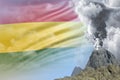 big volcano blast eruption at day time with white smoke on Bolivia flag background, suffer from disaster and volcanic ash concept