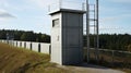 Big watchtower on border. Security of prison, military base Royalty Free Stock Photo