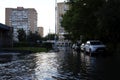 Big water plash in a backyard after rain close to Sverdlov street in Balashikha, Russia. Royalty Free Stock Photo