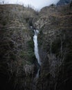 A big waterfall in the mountains, in a dead forest in Torres del Paine National Park Royalty Free Stock Photo