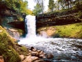 Big waterfall plunging down a cliff in minneapolis.