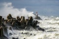 Big wave breaking on breakwater, stormy sea, crashing waves, wave splashing, hurricane season Royalty Free Stock Photo