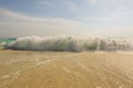 Big wave in Caribbean sea is breaking the coast. Eagle Beach of Aruba Island. Royalty Free Stock Photo