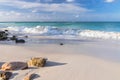 Big wave in Caribbean sea is breaking the coast. Turquoise sea water and blue sky. Eagle Beach of Aruba Island. Royalty Free Stock Photo