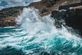 Big wave crushing on rocky coast - waves hit rocks on shore