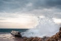 Big wave splash on pier. sea wave breaking on pier. Waves crashing on breakwaters. Waves and a storm at sea Royalty Free Stock Photo