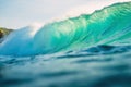 Big wave for surfing in ocean. Breaking turquoise wave in Bali